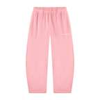 Light pink sweatpants with an elastic waistband and a small white script logo on the upper left thigh, shown flat against a white background.