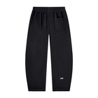 Black jogger sweatpants with an elastic waistband, a side pocket on the right hip, and a small white logo on the lower left leg, shown against a plain white background.