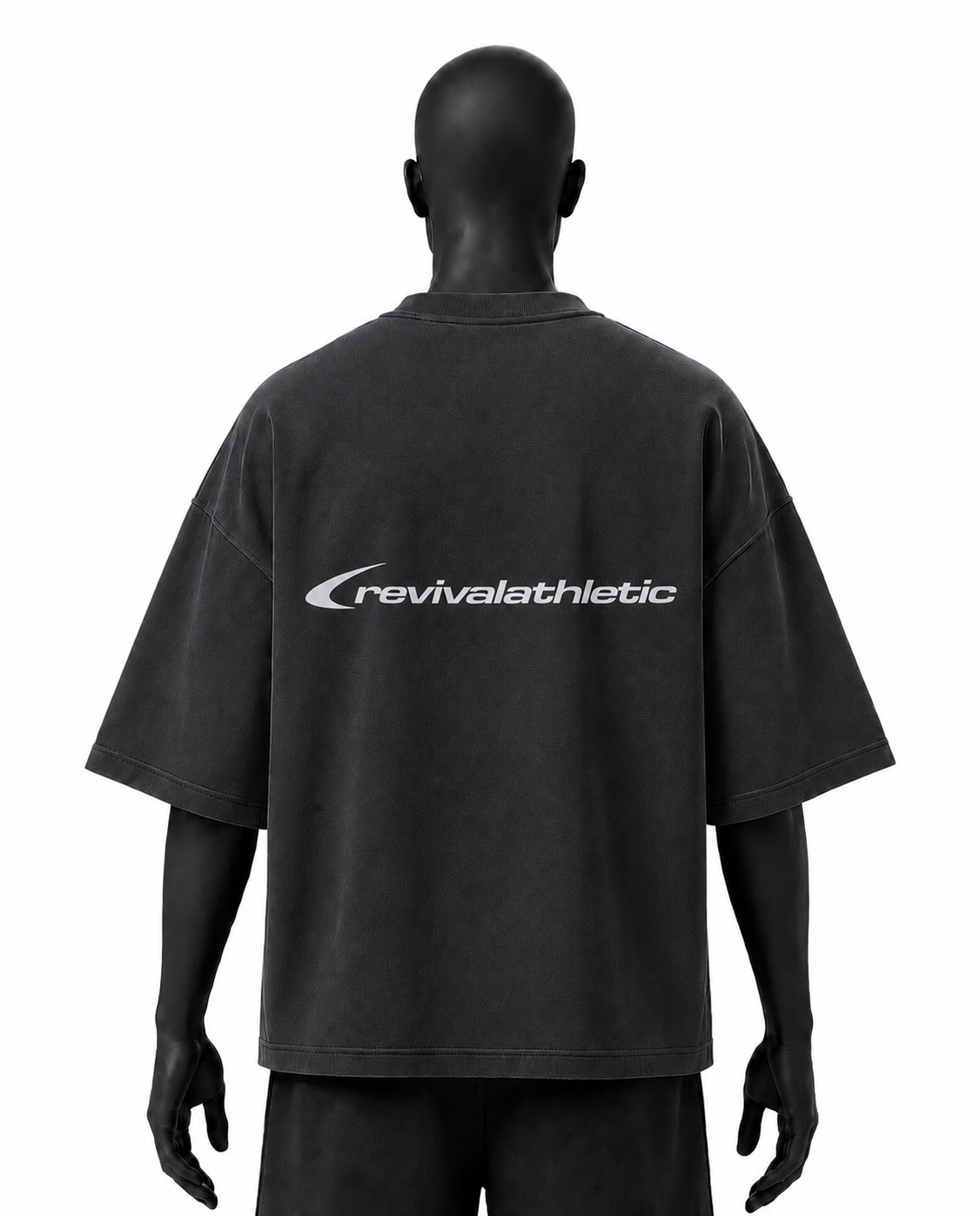 A mannequin shown from the back wearing an oversized black t-shirt with a white 'revivalathletic' logo printed across the upper back, set against a plain white background.