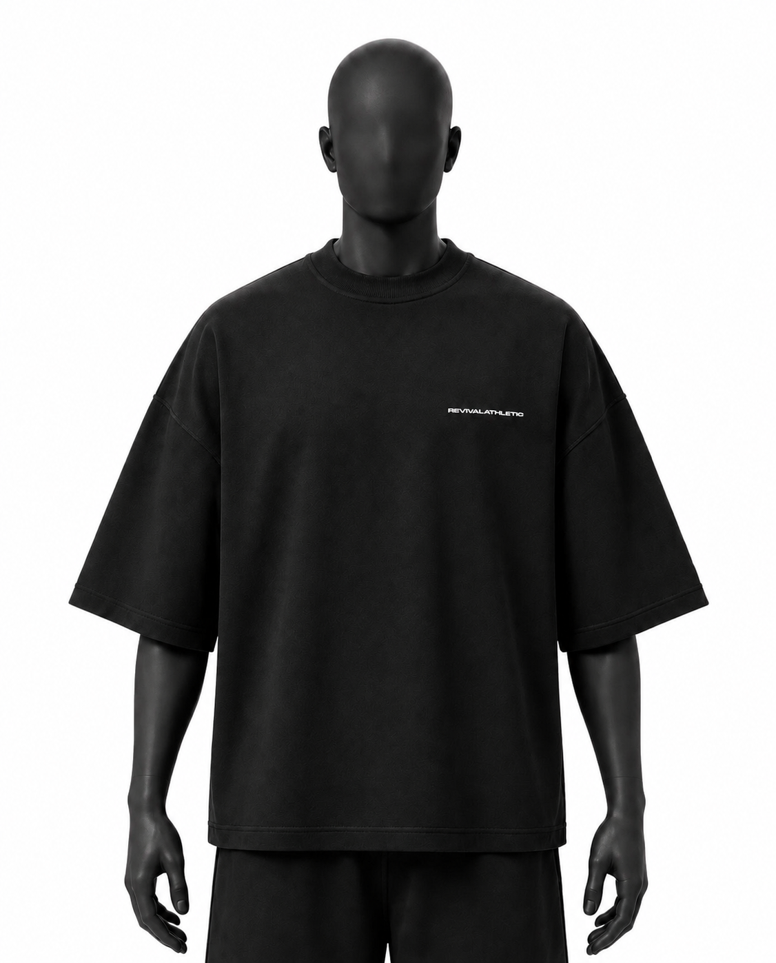 A black oversized short-sleeve t-shirt with a small white 'REVIVALATHLETIC' logo on the left chest, displayed on a black mannequin against a white background.