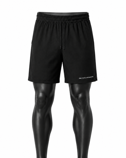 Black athletic shorts displayed on a black mannequin leg form against a plain white background. The shorts feature an elastic waistband with a drawstring and a small white 'REVIVALATHLETIC logo on the lower left leg.