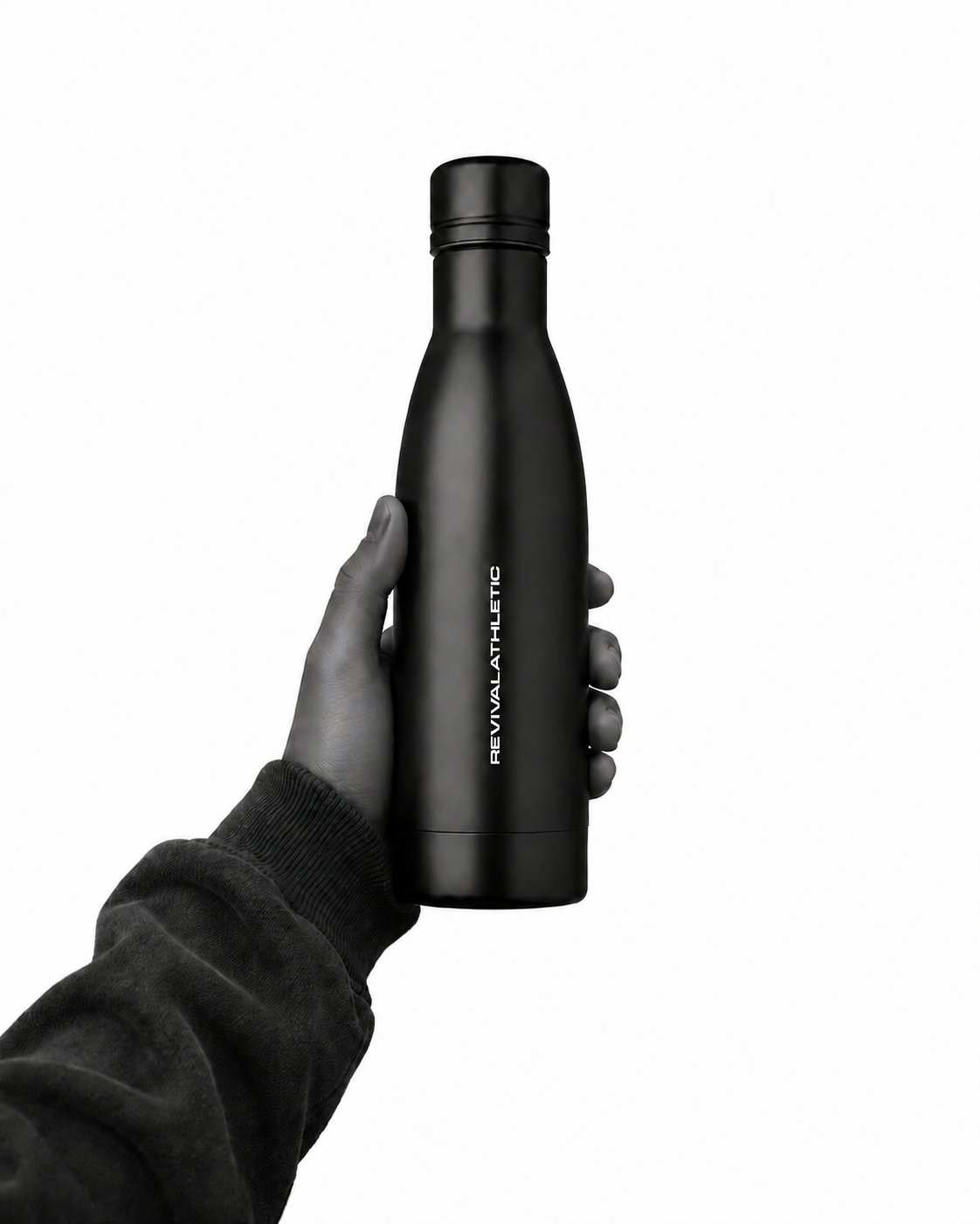 A hand holding a matte black Revival Bottle against a solid white background.