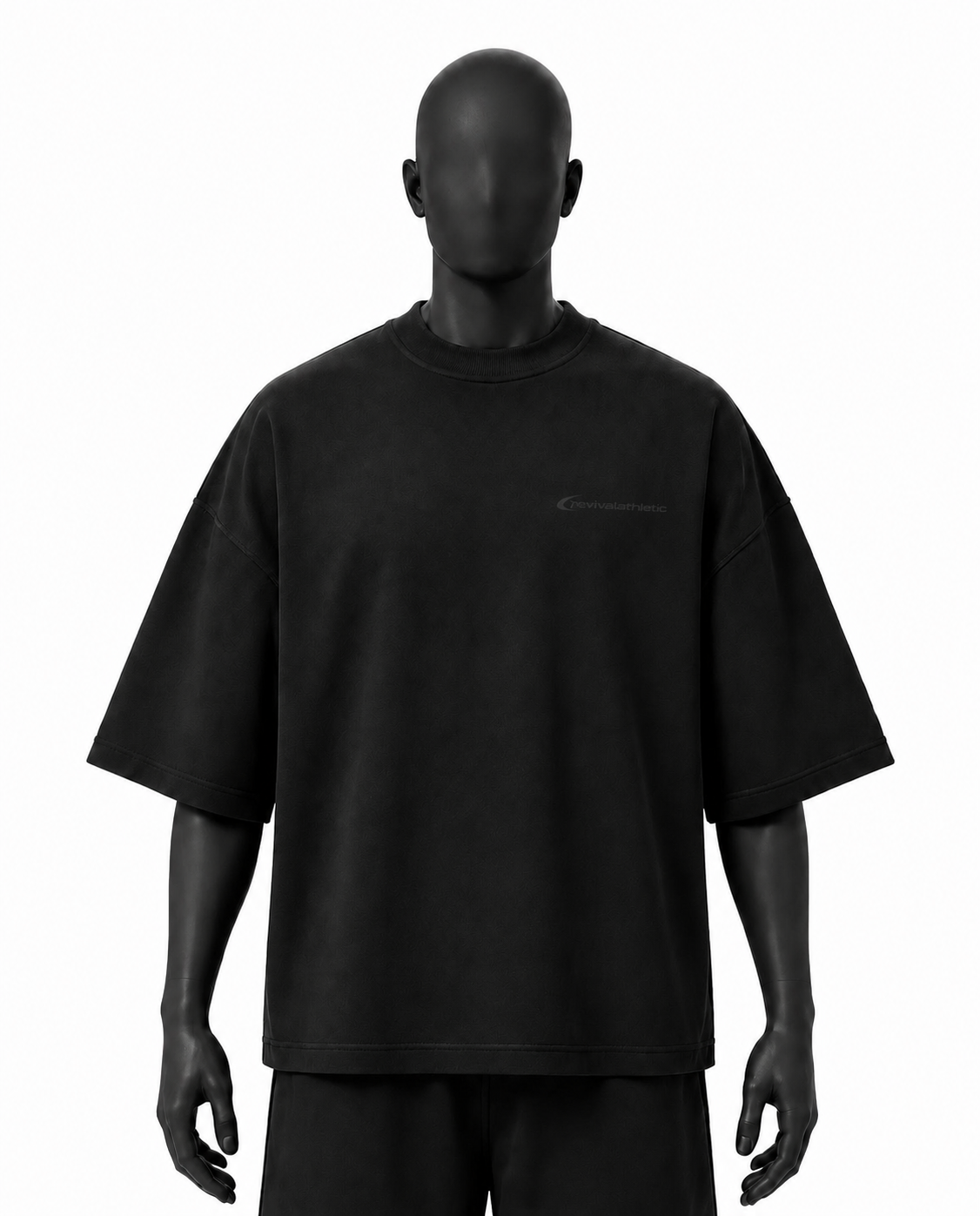 A black oversized short-sleeve t-shirt with a small tonal script logo on the left chest, displayed on a matte black mannequin against a plain white background.