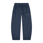 A pair of dark navy blue sweatpants with an elastic waistband and a small white embroidered logo on the left thigh, shown against a plain white background.