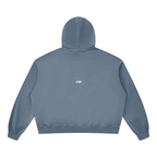 A dusty blue cropped hoodie shown from the back, featuring a small gold embroidered bunny logo centered below the neckline, set against a plain white background.